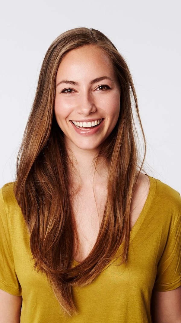 Woman smiling with yellow shirt